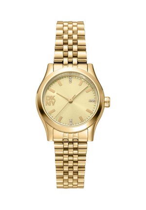 Orologio da polso da donna DKNY in tono oro con bracciale a maglie, quadrante rotondo, indici dorati e piccoli accenti di cristallo a ore 12, 3, 6 e 9.