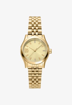 Goudkleurig DKNY damespolshorloge met schakelen armband, ronde wijzerplaat, gouden markers en kleine kristallen accenten op 12, 3, 6 en 9 uur.