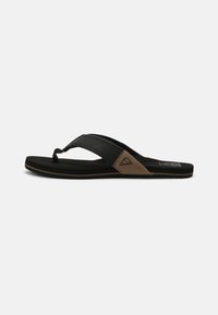 Black flip-flop sandal with a textured black strap and a brown fabric accent. Features a rubber sole with a slight grip texture.