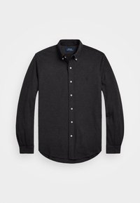 Svart långärmad skjorta i bomull med knappkrage, som har vita knappar och en liten broderad logotyp på bröstet.