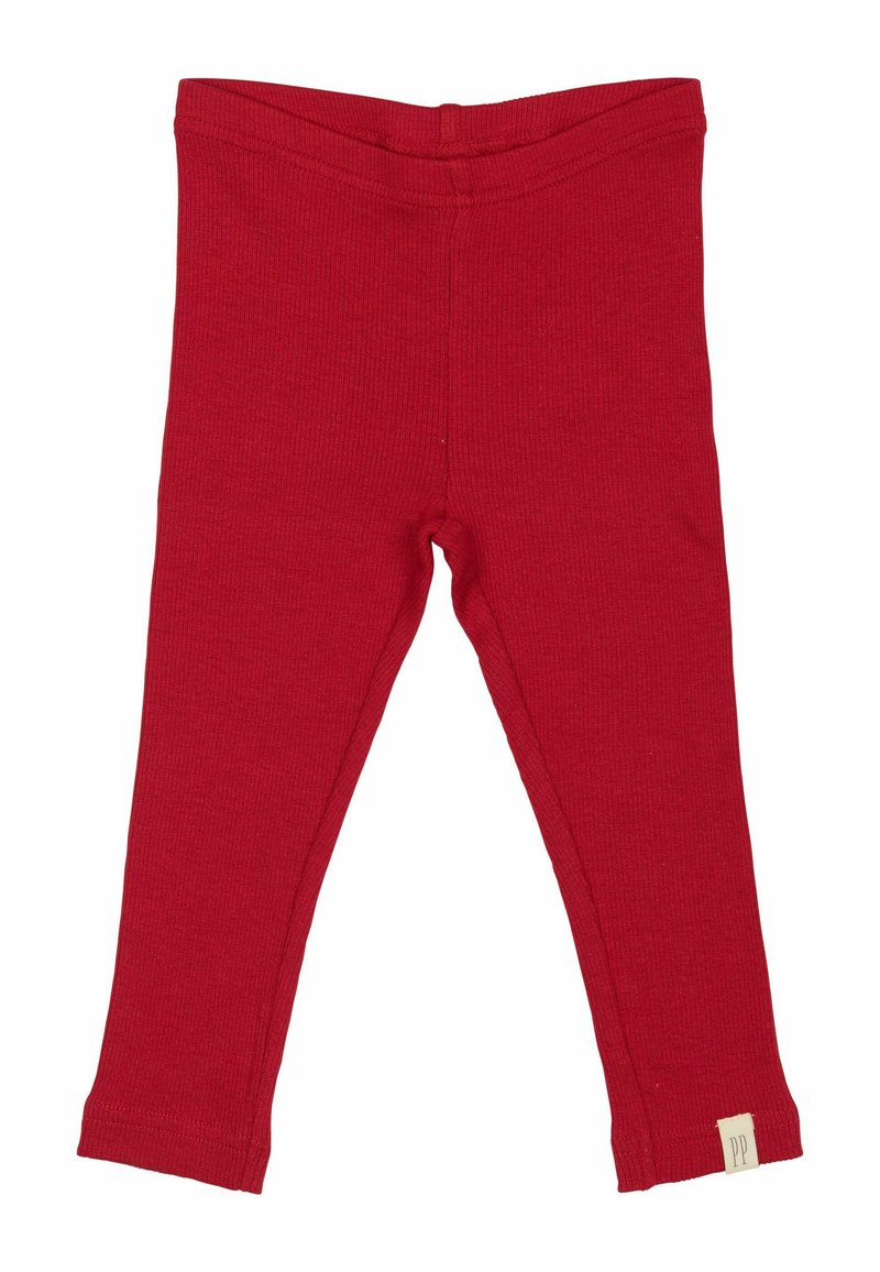 Leggings rojos acanalados con cintura elástica, con una pequeña etiqueta en el dobladillo. La tela tiene un acabado suave y texturizado.