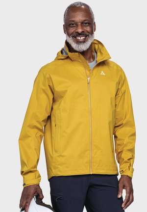 Gelbe wasserdichte Jacke mit Kapuze, vorne mit Reißverschluss und elastischen Bündchen. Verfügt über ein kleines weißes Logo auf der Brust.