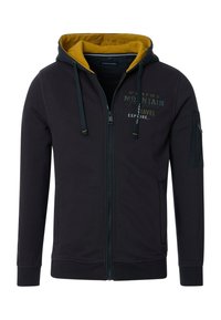 Black hoodie with a yellow inner lining, front zipper, and pockets. Features text logo on the chest and an additional zip pocket on the sleeve.