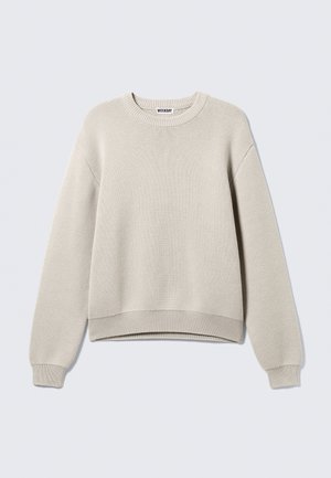 Cremfarbener gestrickter Pullover mit Rundhalsausschnitt, langen Ärmeln sowie gerippten Bündchen und Saum. Strukturiertes Material mit locker geschnittenem Design.