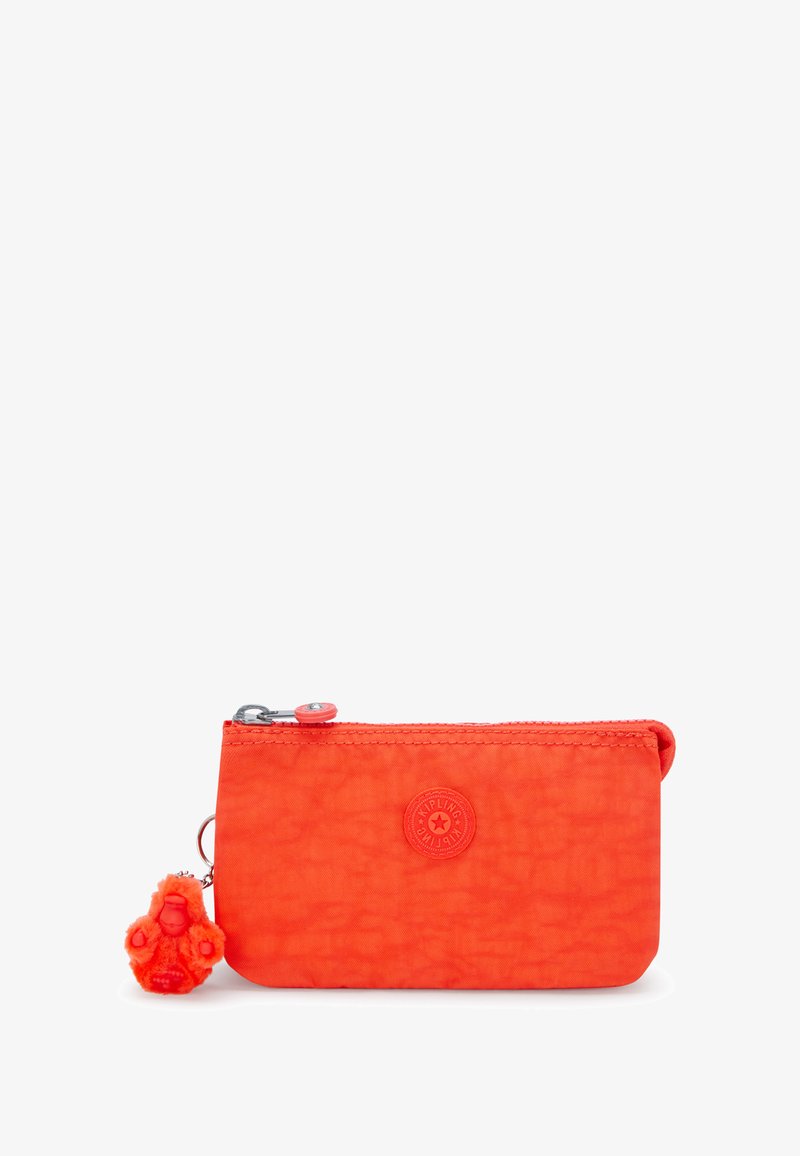 Bright orange zippered pouch made of textured fabric. Features a round logo and a small plush monkey keychain attached.