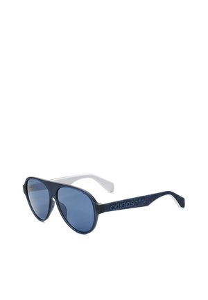 Occhiali da sole aviator con lente tinta blu, montatura bianca e nera, con marchio "adidas" sulle aste.