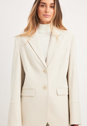 NA-KD Short coat - sand