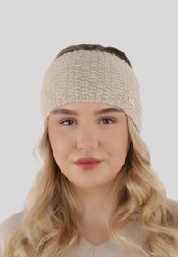 Fascia in maglia beige con un motivo a trama, dotata di un discreto etichetta del logo. Materiale morbido e vestibilità aderente.