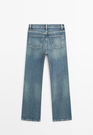 Light blue denim jeans with a straight-leg design, two back pockets, and subtle fading. Features a classic waistband and hem.
