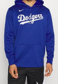 Sweat à capuche Nike bleu avec le logo "Dodgers" en blanc. Confectionné en tissu doux avec une poche avant et une capuche à cordon.