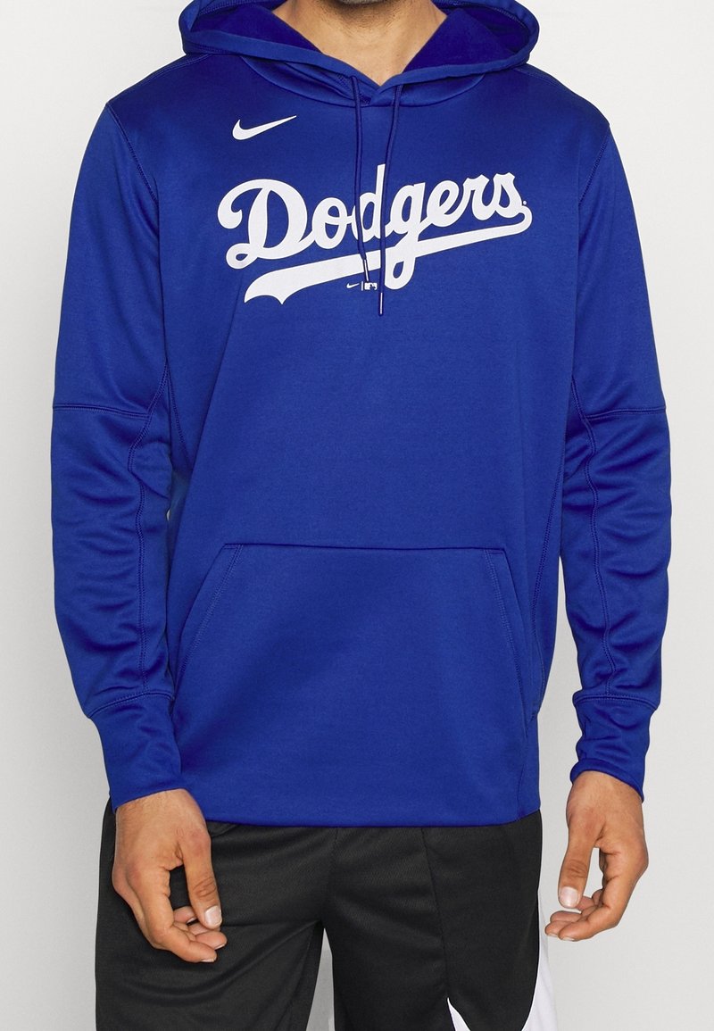 Sweat à capuche Nike bleu avec le logo "Dodgers" en blanc. Confectionné en tissu doux avec une poche avant et une capuche à cordon.