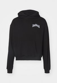 Black hoodie with a front pocket, long sleeves, and a drawstring hood. Features a white printed logo on the left chest. Soft texture.