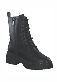Bottines en cuir noir avec un laçage à l'avant, fermeture éclair sur le côté, semelle épaisse et clous décoratifs le long de la base. Texture lisse.