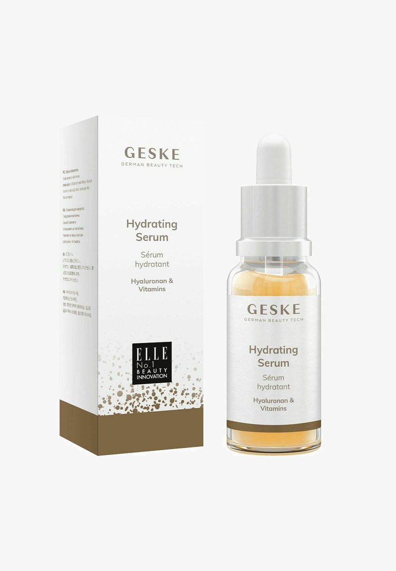 Siero idratante GESKE in una bottiglia di vetro trasparente con accenti argentati, contenente un liquido dorato chiaro. La scatola presenta un design bianco e oro.