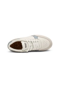White sneaker with light blue stripe, white laces, perforated toe, and cork insole, viewed from above on a white background.