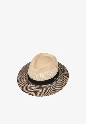 Light beige fedora hat with black and white zigzag wide brim, black band, and perforated ventilation holes around crown.