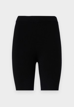 Czarne legginsy z elastycznego materiału, o prostym fasonie z elastycznym pasem w jednolitym kolorze, bez wzorów ani akcentów.