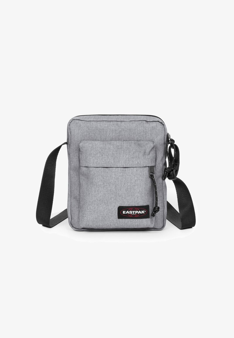 Szara torba messengera wykonana z trwałego materiału, z główną kieszenią na zamek, przednią kieszenią oraz regulowanym czarnym paskiem.