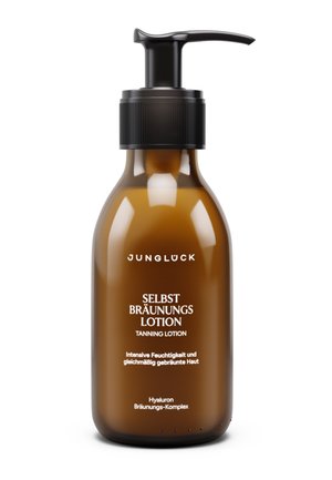 Brown pump bottle labeled Junglück Selbst Bräunungs Lotion tanning lotion with moisturizing and tanning complex text.