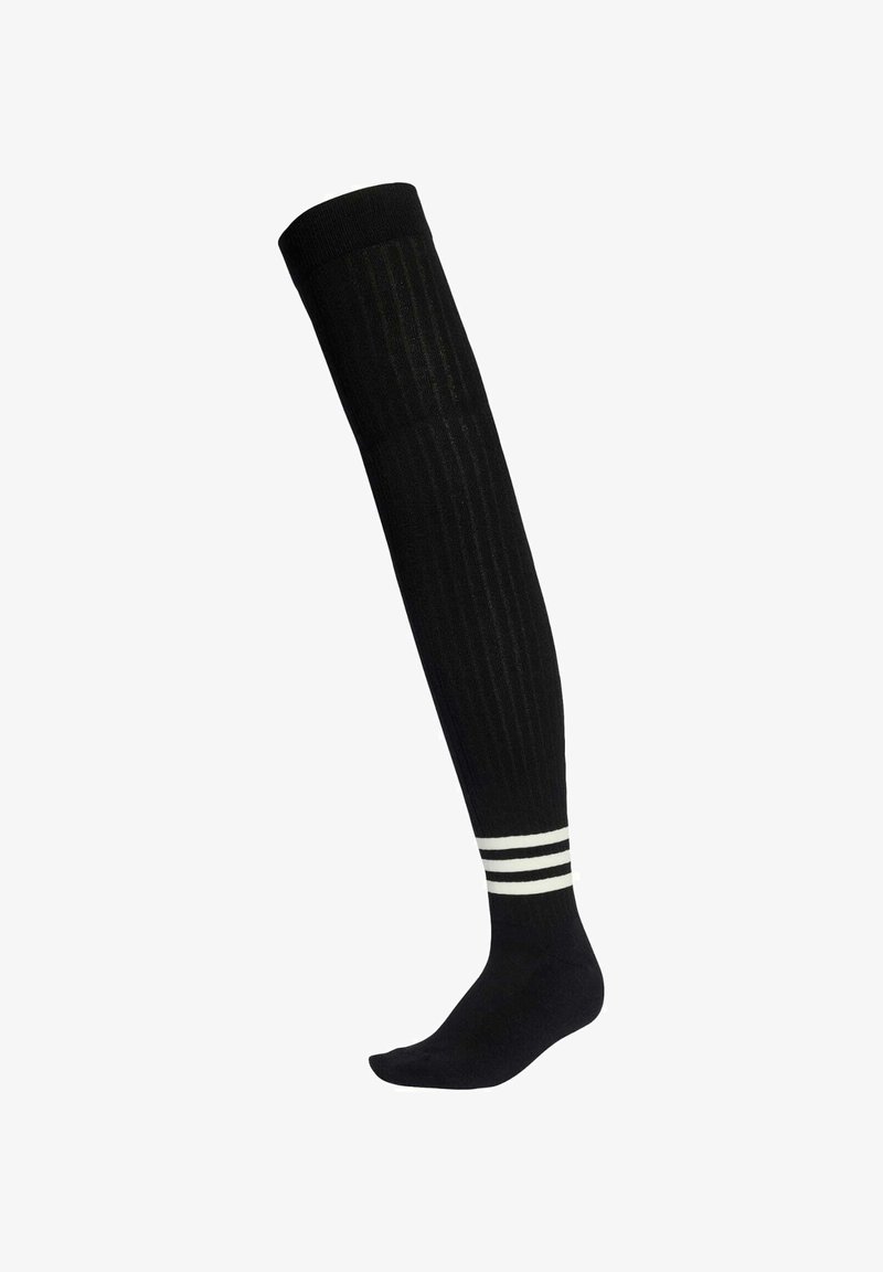 Black knee-high sock with vertical ribbing, featuring three white horizontal stripes at the top and a smooth, soft texture.