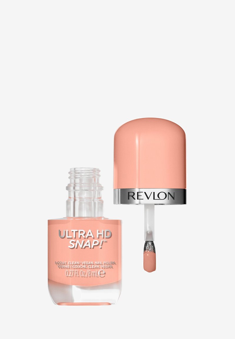 Revlon Ultra HD Snap! nagellak in een heldere glazen fles met een afgeronde, blush roze dop. Zachte perzikkleur binnenin, inclusief een standaardkwastapplicator.