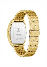 Gold stainless steel watch with a rectangular case, link bracelet, and a polished back displaying brand and water-resistant details.