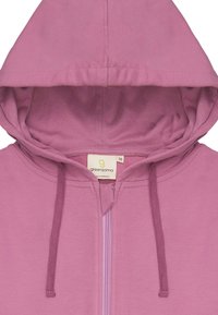Felpa rosa chiaro con zip, cappuccio regolabile e dettagli a coste, etichetta interna. Tessuto morbido con una texture liscia.