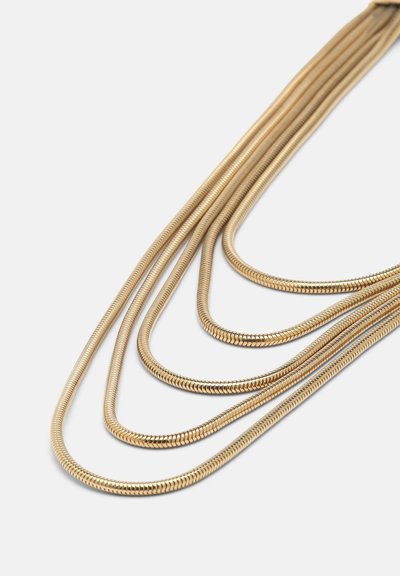 Aukso, daugiakapis vėrinys, kuriame yra lygių, suapvalintų jungčių, turinčių subtilią, lanksčią tekstūrą, išdėstytas plokščiai ant baltos foninės.