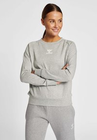 Gray sweatshirt made of soft fabric, featuring a round neckline, ribbed cuffs, and a small white logo on the chest.