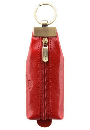 Red leather keychain pouch with a metal zipper, brass hardware, and embossed logo. Compact, rectangular design, smooth texture.