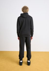 Puma Teplákové kalhoty - puma black