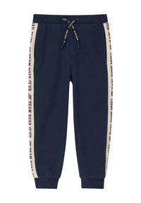 Marinefarbene Sweatpants aus Baumwollmix, mit seitlichen Streifen in Creme und Bordeauxrot sowie den Worten "TEAM ROAR" und einem elastischen Bund mit Kordelzug.