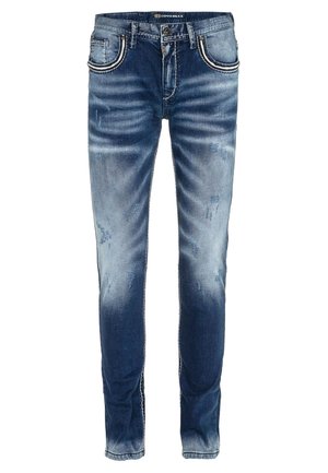 Denim jeans in medium blue met een vervaagde afwerking. Opvallende gescheurde delen en contrasterende stiksels op de zakken. Slim fit ontwerp.