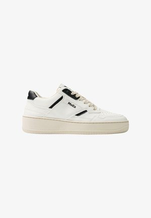 White sneaker with black accents, made from smooth leather. Features a thick sole, round toe, lace-up front, and perforated detailing.