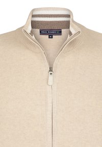 Beige Zip-Up-Pullover mit ribbeltem Kragen und strukturiertem Strick. Besitzt ein zweifarbiges, gestreiftes Halsdetail und einen Metallreißverschluss. Größe M.