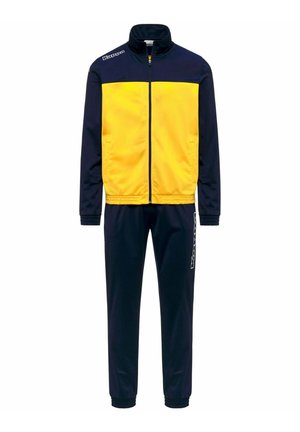 Giacca blu navy e gialla con zip abbinata a pantaloni blu navy, polsini elasticizzati e loghi Kappa sulla spalla della giacca e sulla gamba dei pantaloni.
