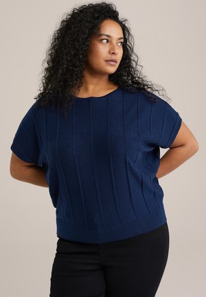 Navy blue knitted top featuring horizontal ribbed texture, short sleeves, and a relaxed fit, paired with black pants.