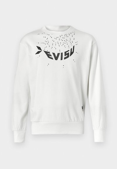 Valge sweatshirt, millel on suur must "EVISU" logo, hajutatud väikesed mustad punktid ning soonikkoes mansetid ja alläär. Pehme puuvillane materjal.