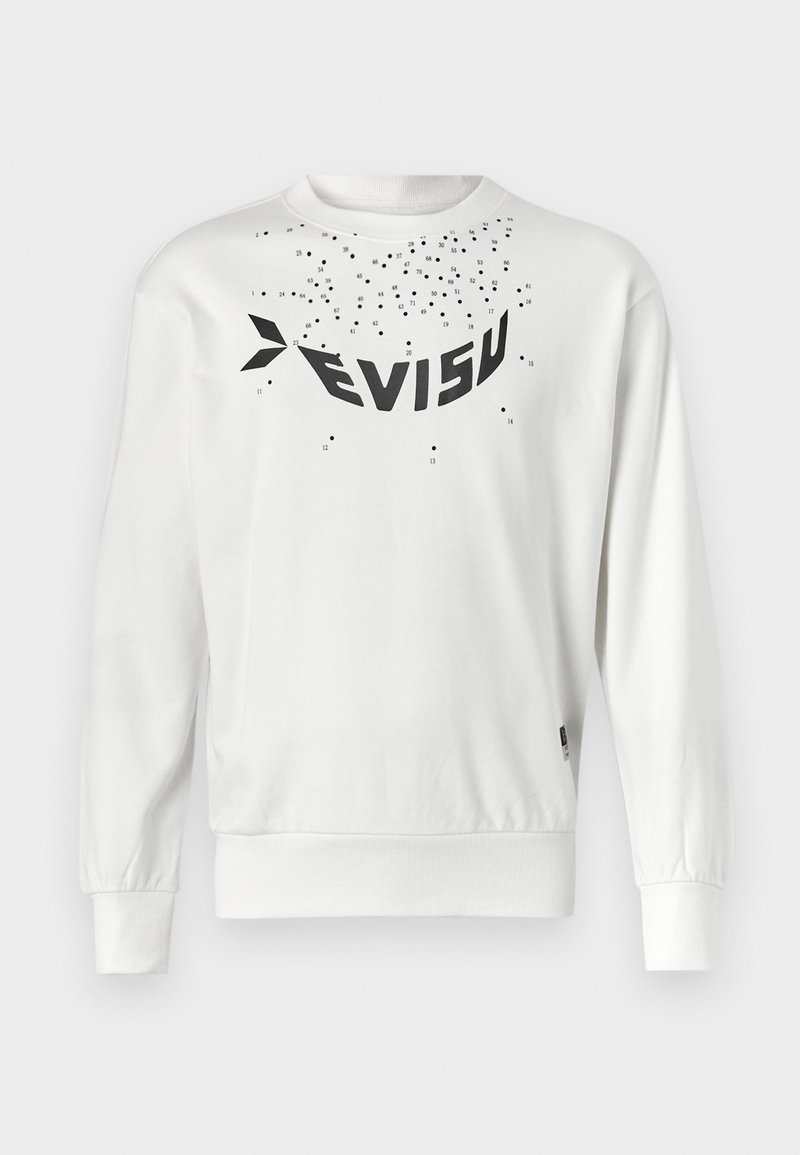 Vit sweatshirt med en stor svart "EVISU"-logotyp, spridda små svarta prickar samt ribbade ärmslut och nederkant. Mjuk bomullsmaterial.
