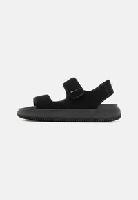 Svarte sandaler med justerbare borrelåser, en polstret såle og en teksturert gummisole. Minimalistisk design med en strømlinjeformet profil.