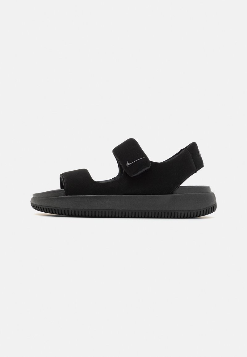 Svarte sandaler med justerbare borrelåser, en polstret såle og en teksturert gummisole. Minimalistisk design med en strømlinjeformet profil.