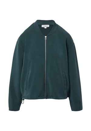 Giacca bomber teal in tessuto morbido e testurizzato. Presenta una chiusura a zip frontale, due tasche laterali e un colletto arrotondato. Lunghezza cropped, vestibilità rilassata.