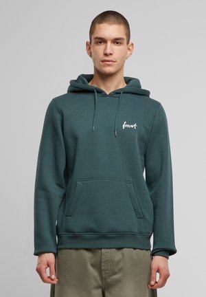 Teal kapuutsvet, mis on valmistatud pehmest kangast, esiküljel on tasku, nööriga kapuuts ja valge "forvet" logo rinnal.