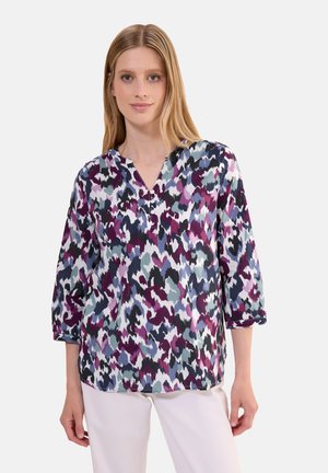 Multicolored shirt featuring a v-neck, three-quarter sleeves, in patterns of purple, teal, and white. Made of lightweight fabric with a relaxed fit.
