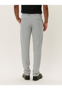 Light gray trousers with a subtle, textured pattern, featuring two back pockets and a straight-leg design. Pairing with black shoes.