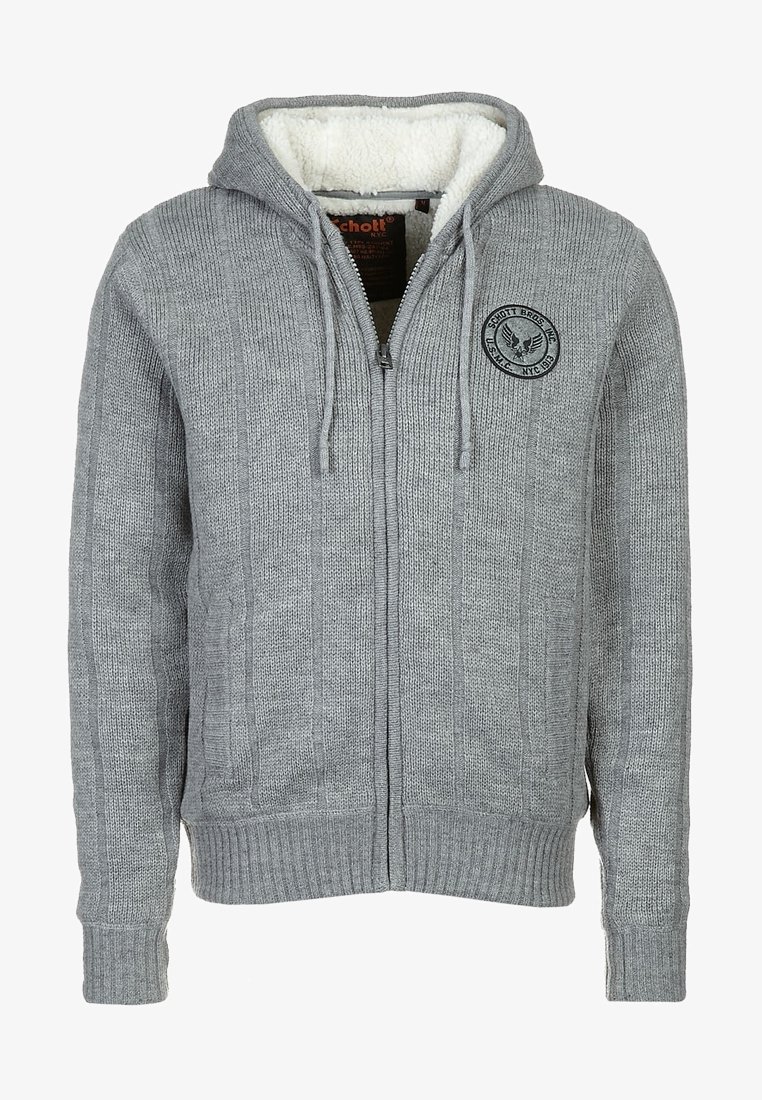 Hoodie gris en tricot avec fermeture éclair, cordons de serrage, poignets et ourlet côtelés, doublure en polaire, et un patch logo rond noir sur la poitrine.