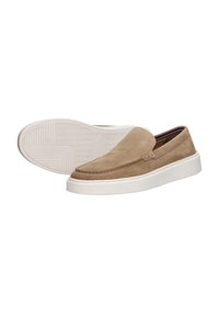 Beige suede slip-on shoes with a white rubber sole, featuring stitching details and a rounded toe. Textured upper with minimal accents.
