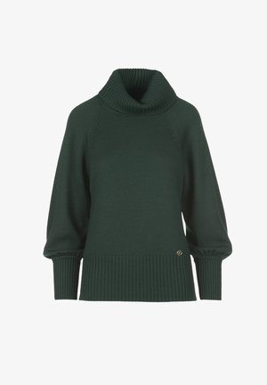 Tamsiai žalia megztinis su raukšlėta aukštu kaklu, pūstais rankovėmis ir raukšlėtais rankogaliais. Yra mažas metalinis logotipo elementas apatinėje pusėje.