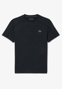 T-shirt nera a maniche corte realizzata in cotone con scollo rotondo. Presenta un piccolo logo di coccodrillo verde sul petto e cuciture a contrasto.