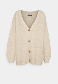 Béžový kardigan s V-výstřihem, ribbovanou strukturou a dlouhými balónovými rukávy. Má šest velkých, kulatých, světle hnědých knoflíků po celé délce vpředu.